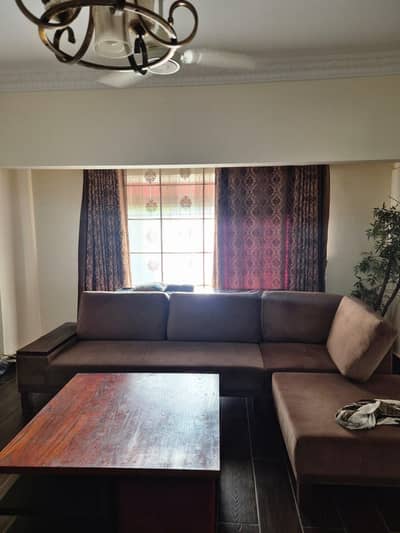 Interwood L shaped sofa and table