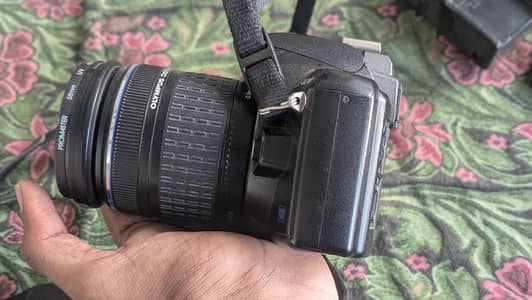 DSLR camera Olympus with 2 lenses. (portrait and simple)