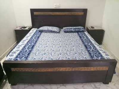 double bed with side tables