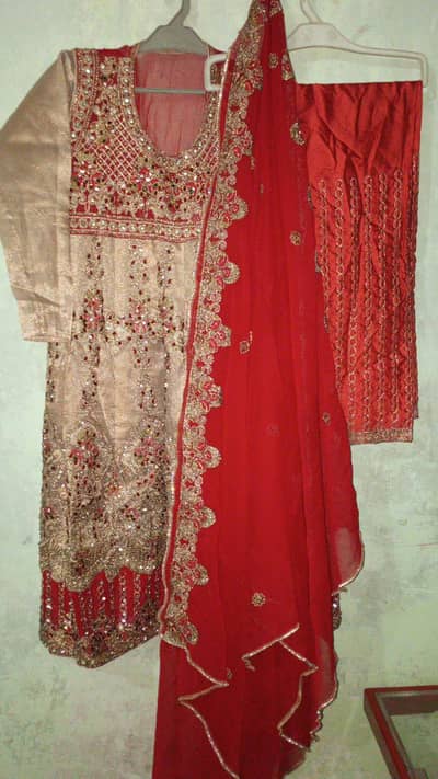 Eastern red gold (pinkish) wedding frock with front heavy embroiderd