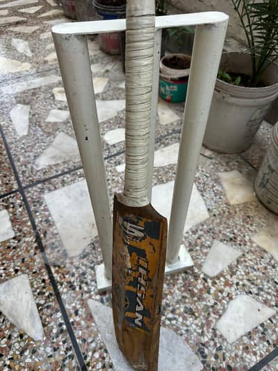 Cricket Bat and Metal Wicket