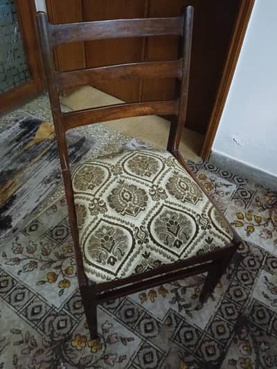 wooden dining table with six chairs