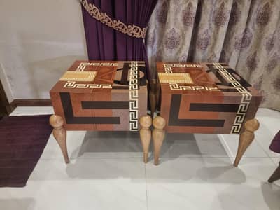 A set of designer's side tables and cupboard