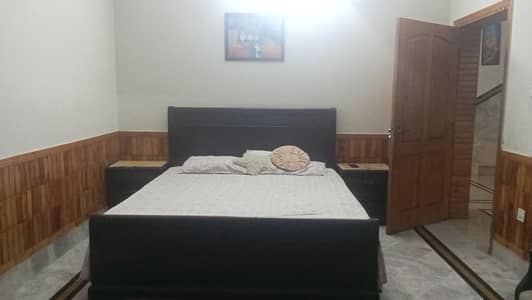 wooden king size double bed witb side tables and dressing table