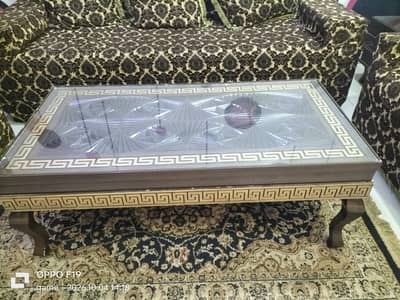 Sofas with covers and centre table(03452464111) contact on this num