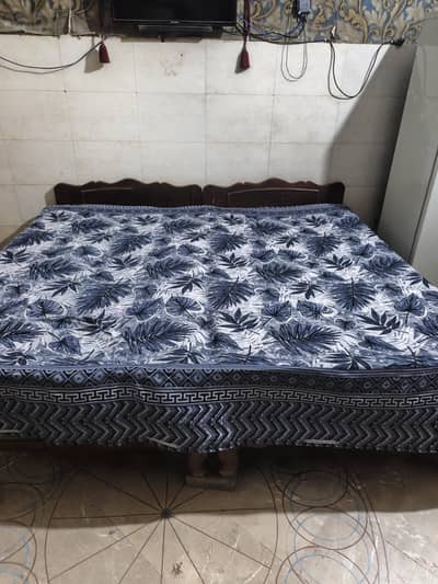 double bed hy with matrix and 2 bed sheets neechy plai lagi hui hy