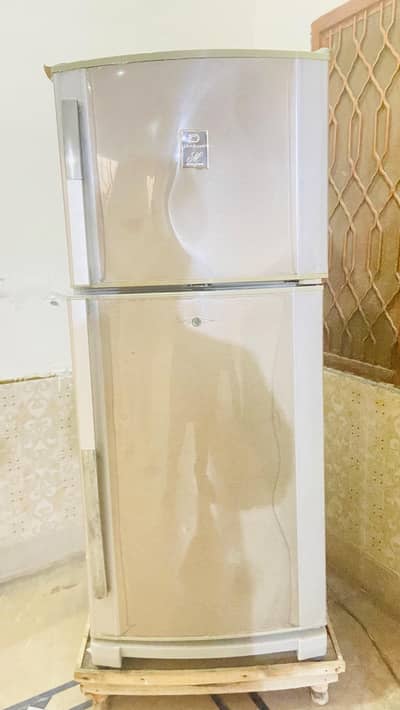 dawlance frig good model neat and clean condition good cooling