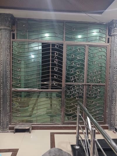 Iron frame with mirror and door