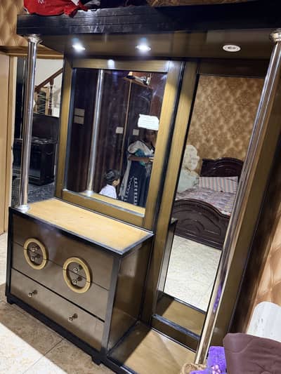 A dressing table and a mini showcase