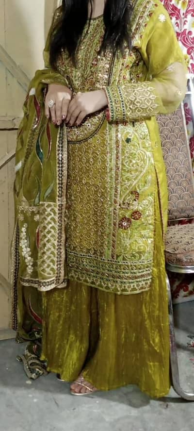 Beautiful and elegant olive green embroidered party wear suit.