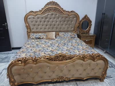 bed with two side tables and dresing