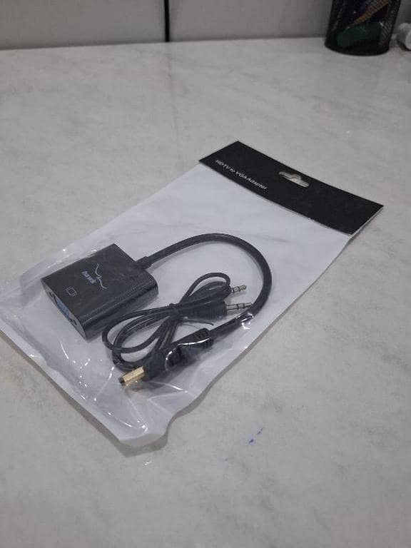 Hdmi 2 vga conerter with ox cabl HDMI to VGA Adapter with 3.5mm Audio Cable. From the photo, it is designed to connect a modern HDMI-output device to an older monitor or projector that has a VGA input