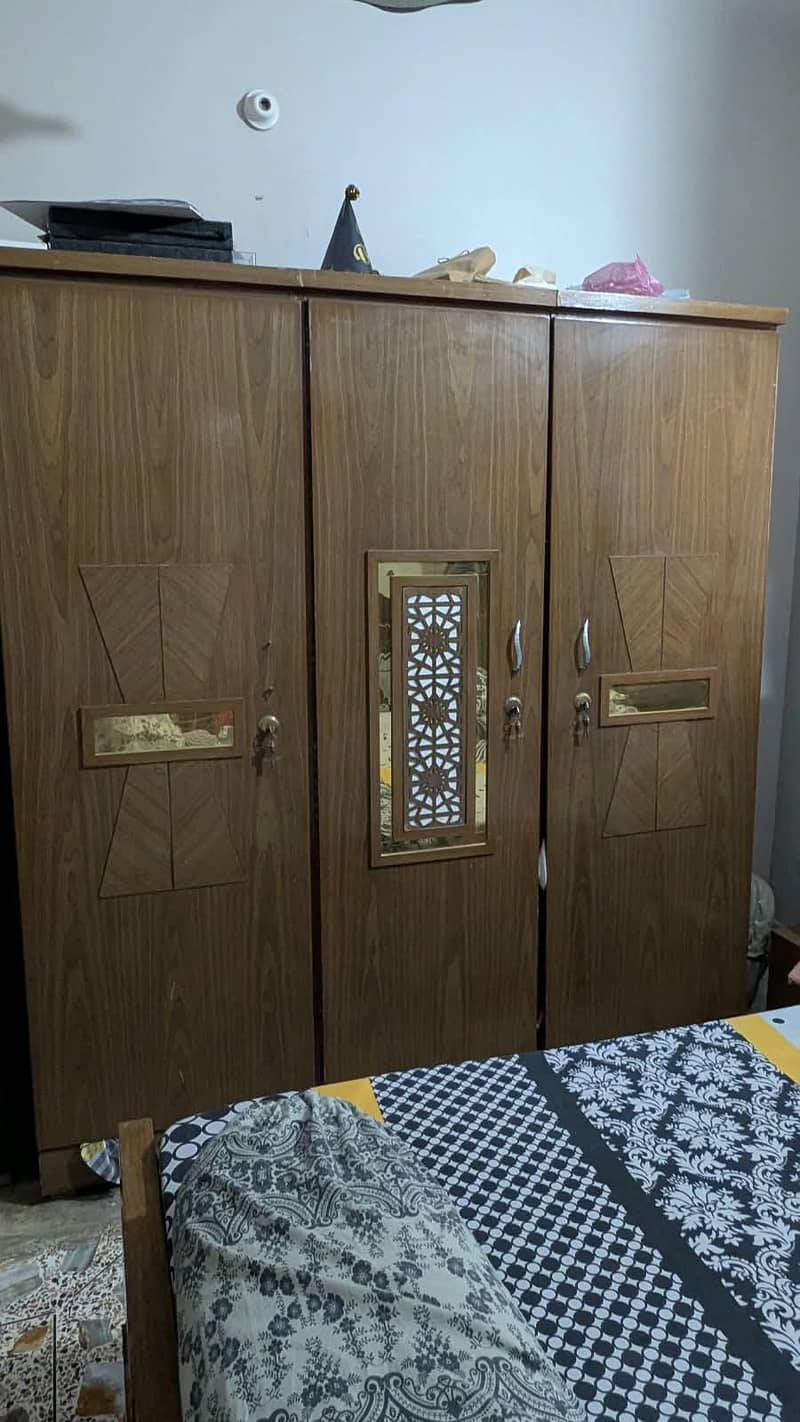 complete bed set with cupboard, side table & wardrobe. 9