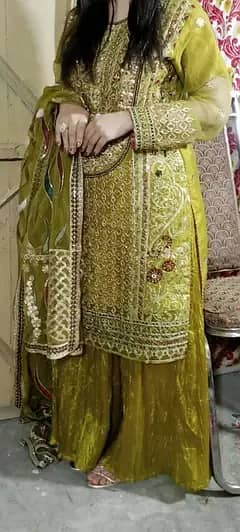 Beautiful and elegant olive green embroidered party wear suit.