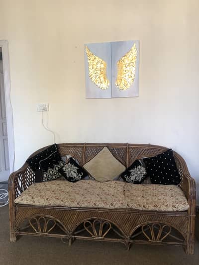4 seater cane sofa