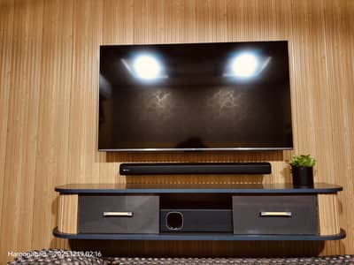 TCL android 50inch led tv with uv rack and sound system audience