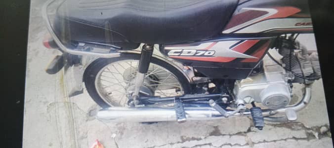 selling Honda cd 70 . neat and clean bike . rear new tyre . just buy and