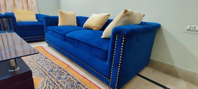 tufted blue velvet Chesterfield sofa