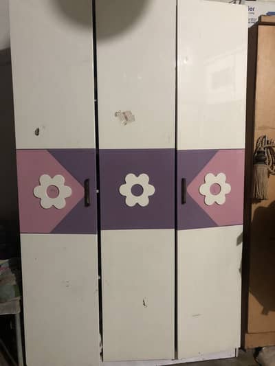 Single bad and wardrobe with side table
