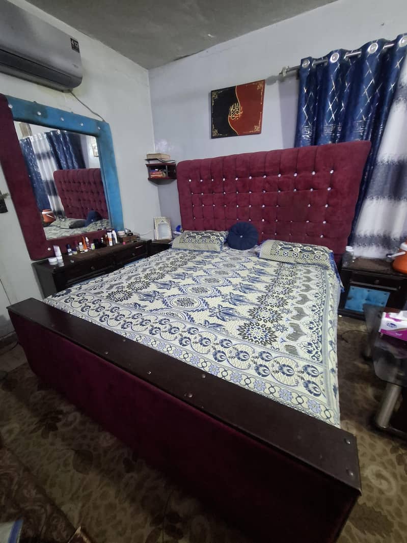 bed with side tables and dressing 0