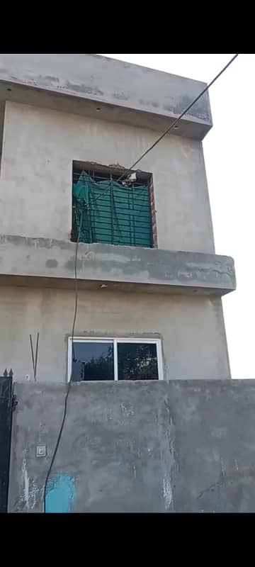A semi furnished house for sale in P block khayban e amin housing society.