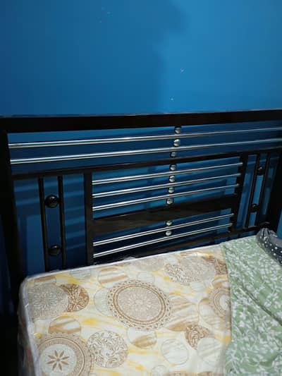 single iron bed with mattress