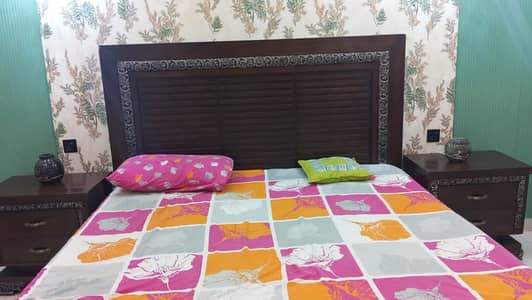 Wooden bed with 2 side tables in good condition