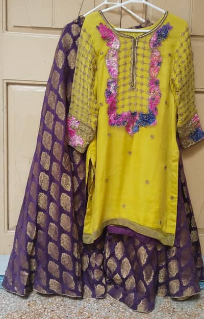 A fancy embroidered yellow and purple shirt,sharara 3-piece set