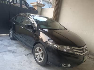 Honda City 2013 black . total orginal paint 2nd ower neat and clean.