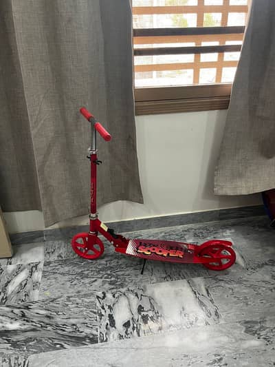 2 kick scooters(1 red, 1black) for kids upto 14 years