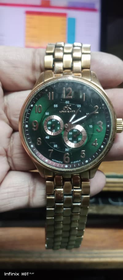 ak original American watch with green dail and golden chain