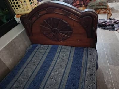 single used wood bed