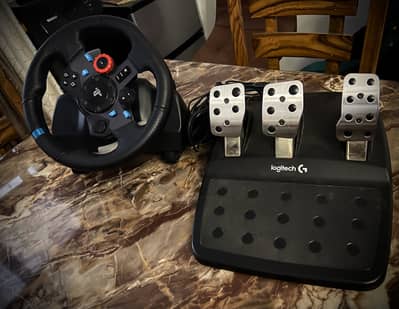 Logitech G29 steering wheel and  paddles.