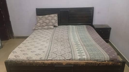 wooden bed and almari