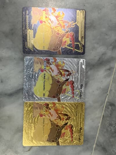 Charizard and Pikachu golden white and black theme Pokémon cards