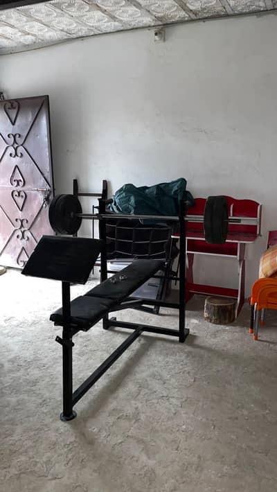 highly adjustable bench press with benchpress bar and weight plates