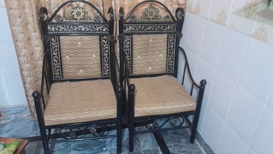 Iron bed with two chairs