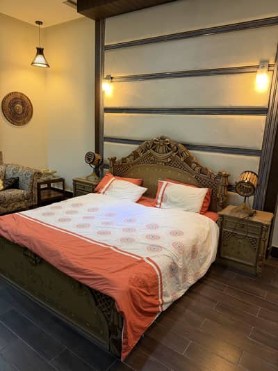 bed with 2 side tables and 2 extra tables