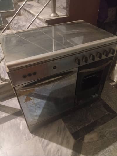 cooking range with 5 stoves and 2 gas oven