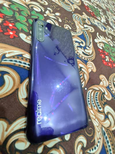 Realme 5 4/64 Screen a bit cracked but original.