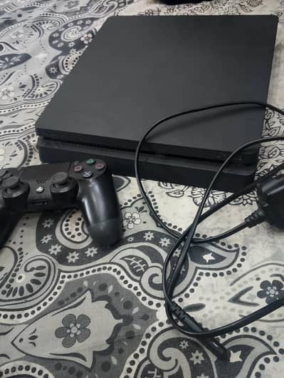 play station 4 slim with 4 games