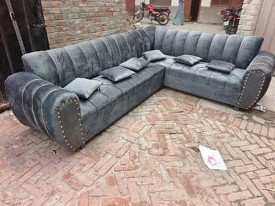 gry sofa with golden brass