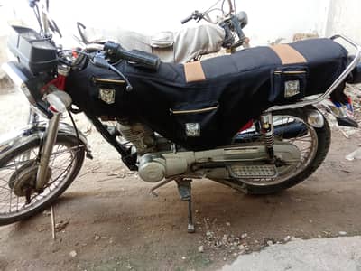 urgent sale CG Honda 125 Faisalabad number all documents clear all ok