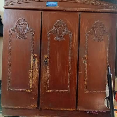 Wooden 3 door cupboard in good condition.