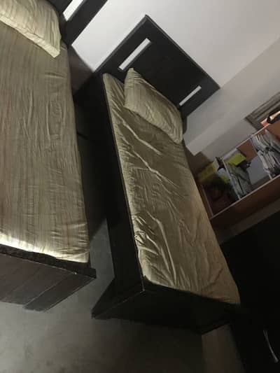 Wooden single bed with mattress