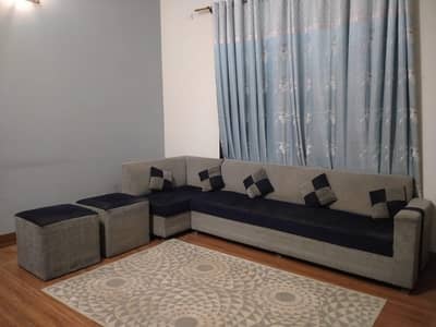 L-shaped seven seater sofas. . Blue and gray in color in good condition