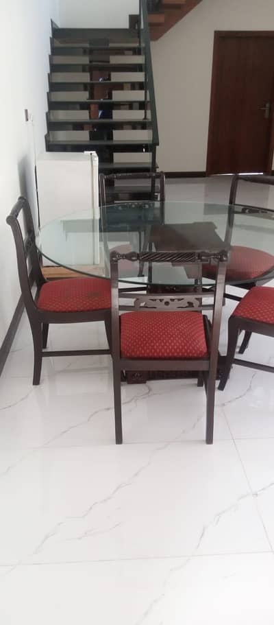 One dining table along with 5 dining chairs
