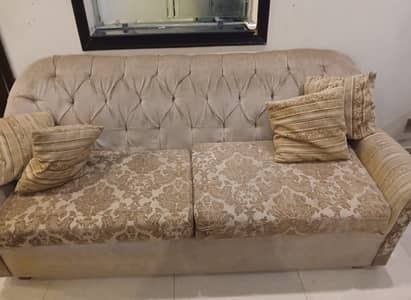 8 seater sofa with cushions and coffee table