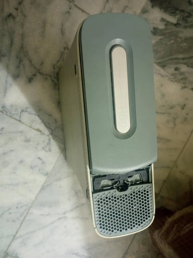 XBOX 360 WITH ONE WIRED AND A WIRELESS CONTROLLER 2