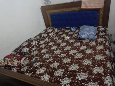 king size bed one side table and dressing table